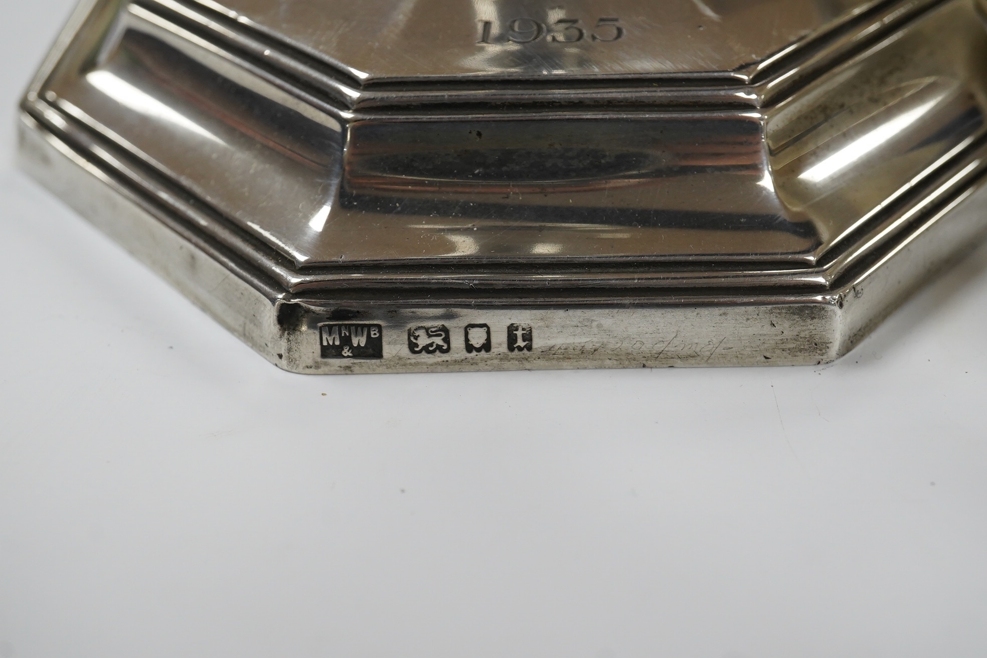 A George V silver octagonal electric lamp base, by Mappin & Webb, London, 1934, with engraved dates, overall 34.2cm. Condition - fair